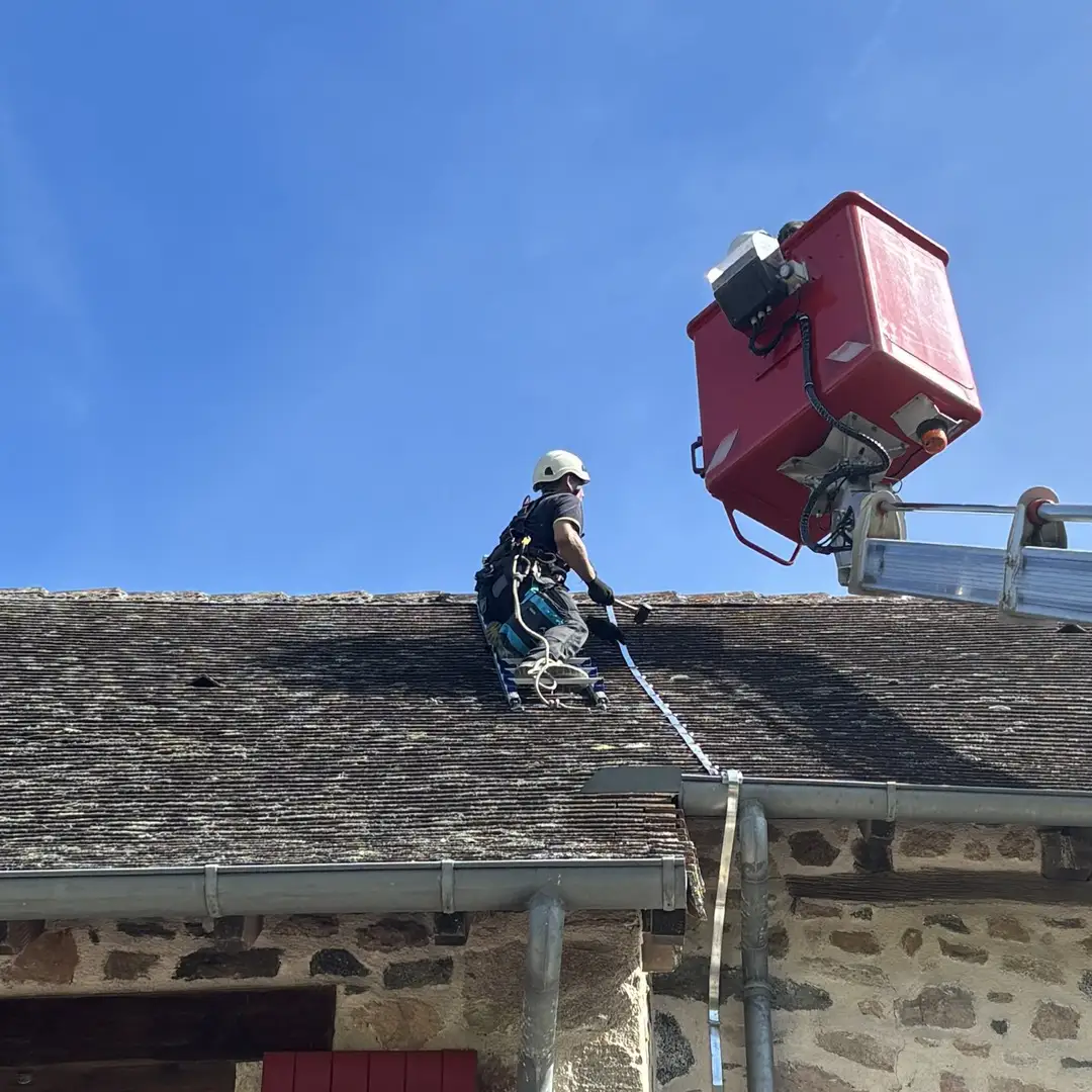Lightning protection installation on a roof with a technician and one aerial bucket